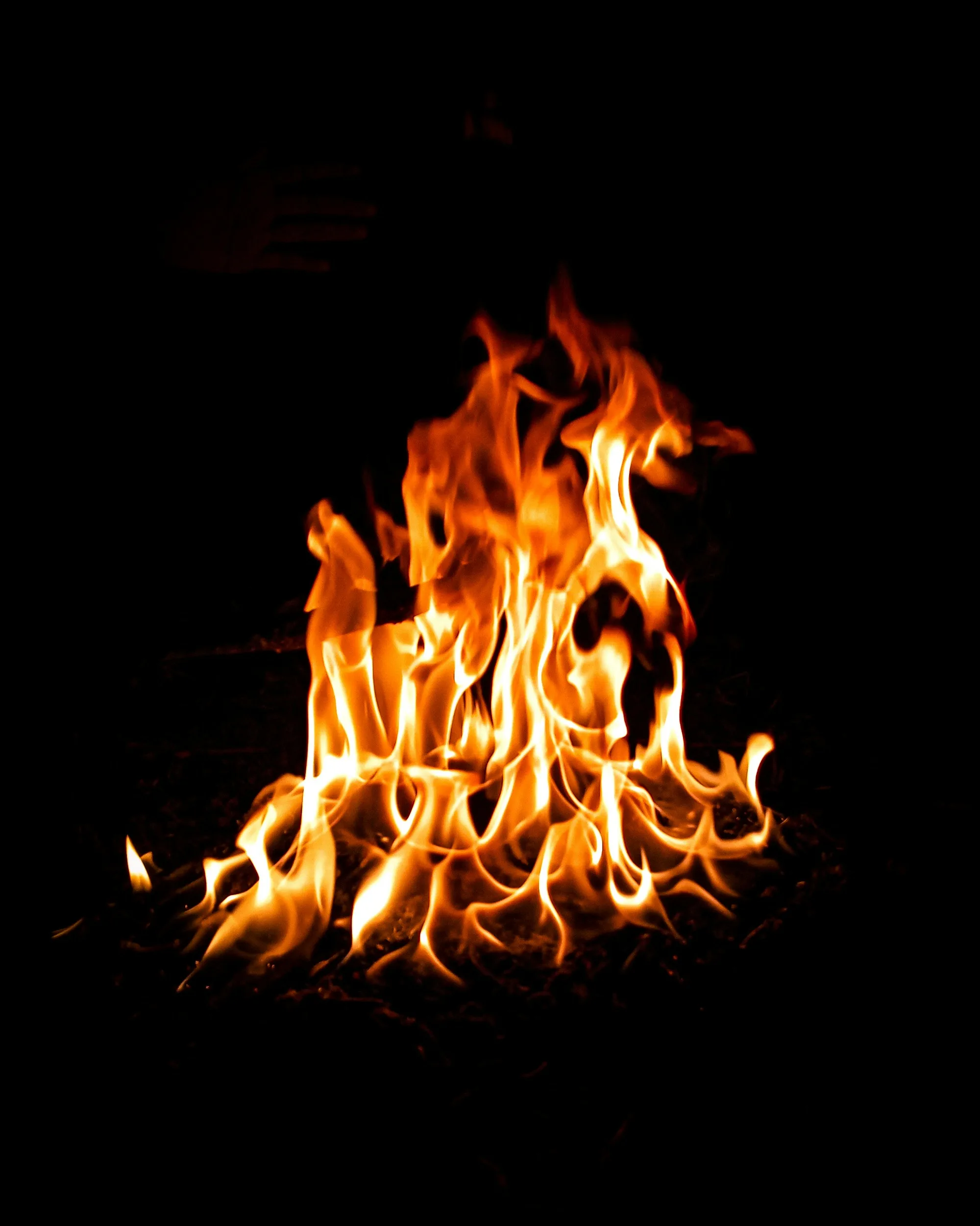 Tortilla being toasted over open flame